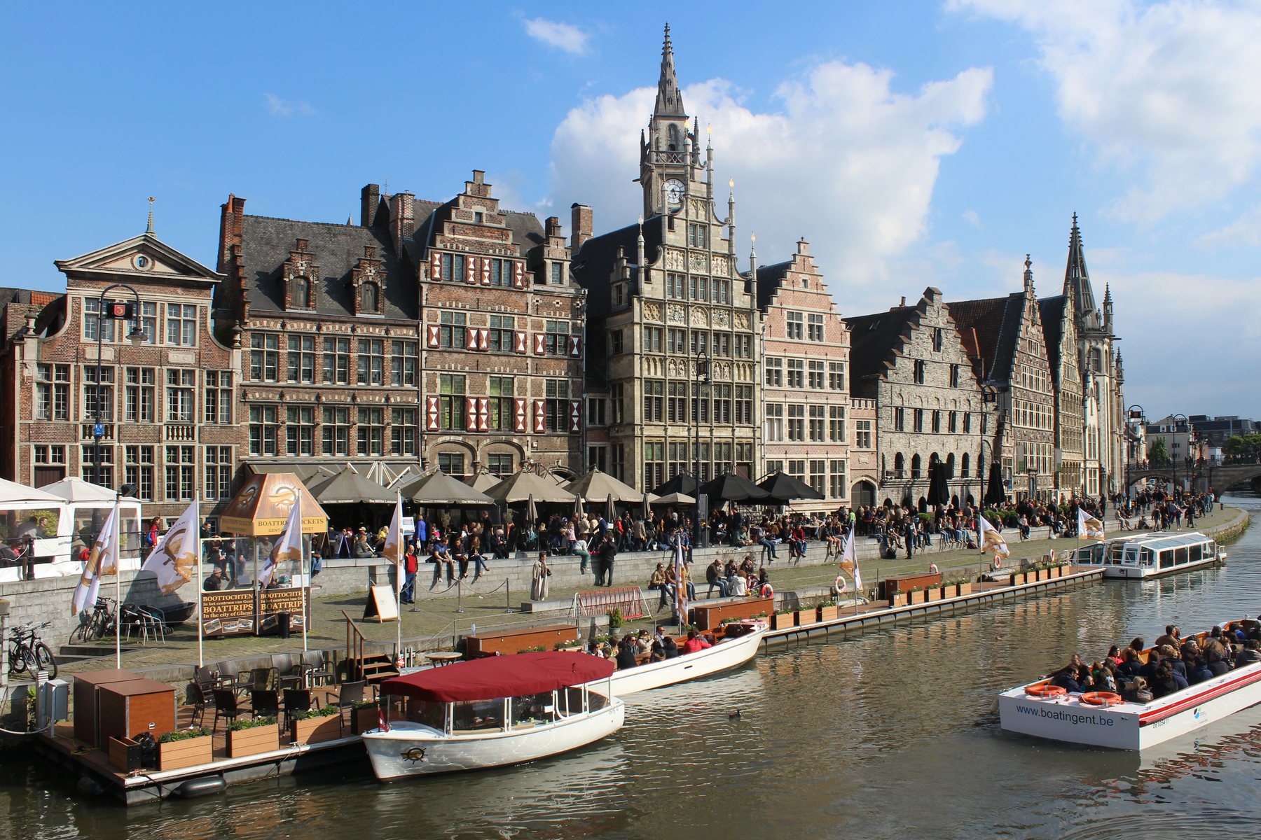 Historic canal houses reflected in the water in Ghent